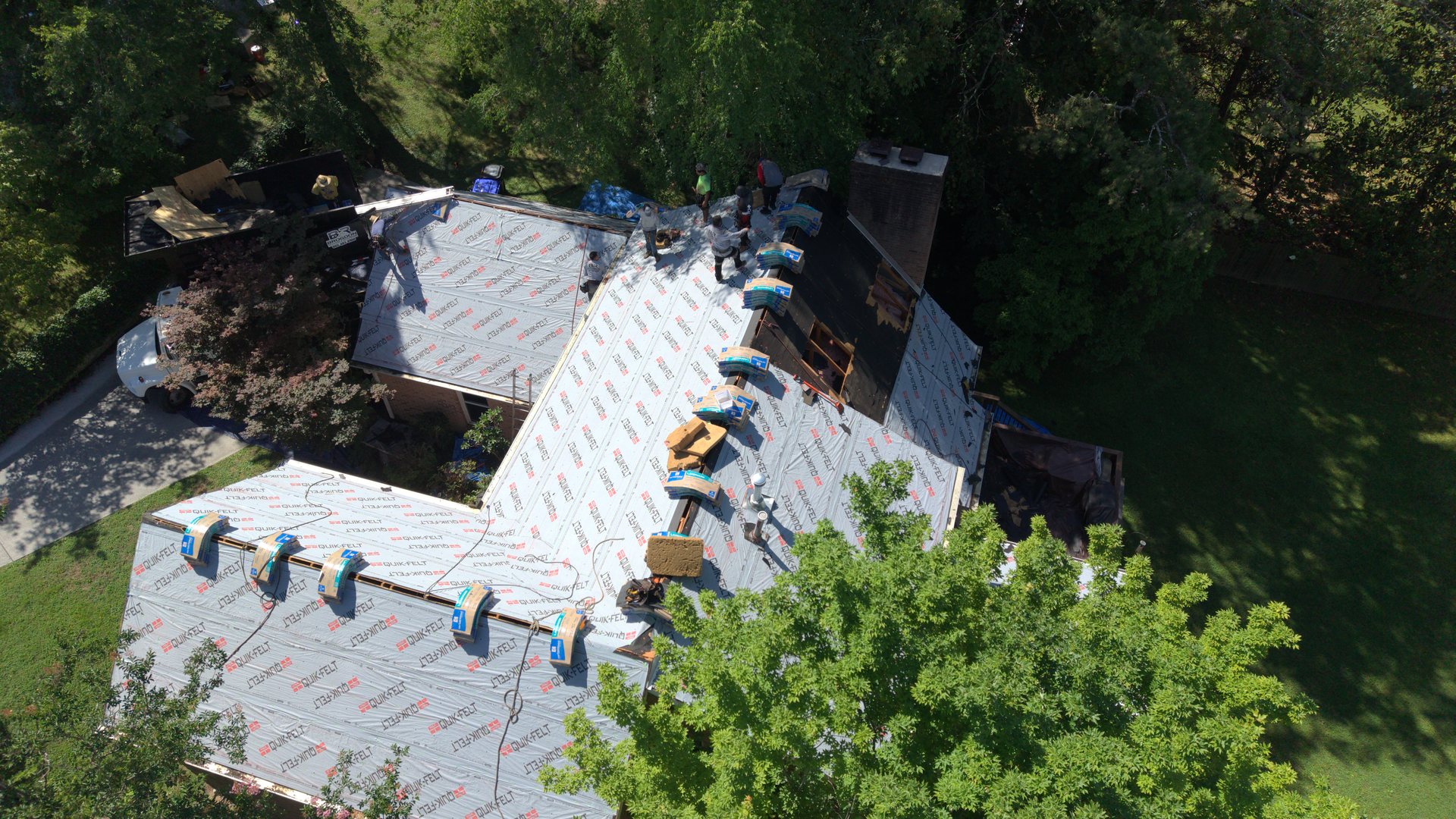 Aerial view of a Brogdon Roofing crew replacing a roof in Oak Ridge, TN