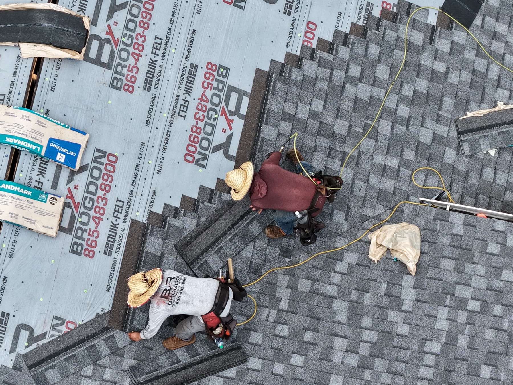 Brogdon crew installing architectural shingles over branded underlayment